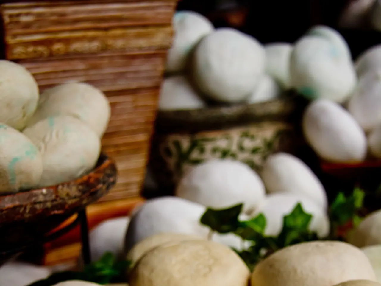 In this image we can see stones and some containers.