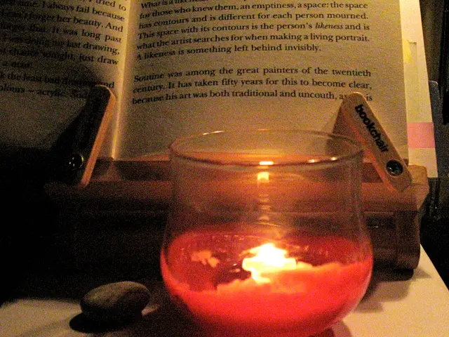 In this image at the bottom, there is a table on that there are books, candles, glasses, text and...