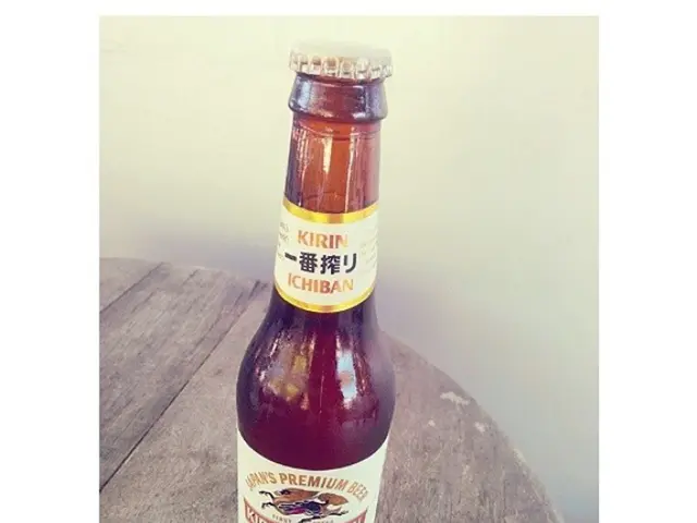 There is a bottle in image. In which it is labelled as kirin ichiban. which is placed on table and...