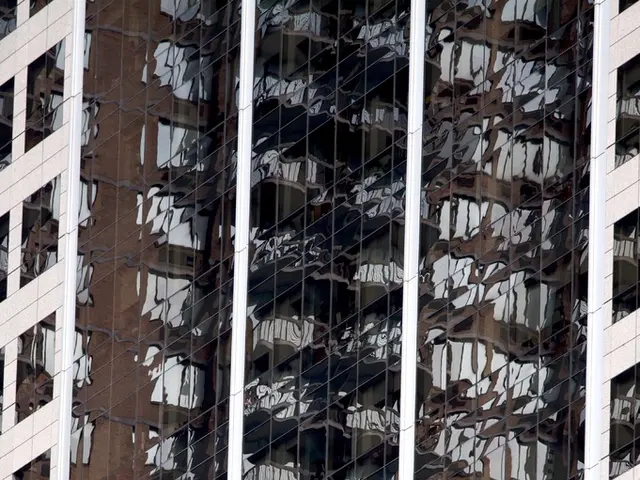 In this image, we can see there are buildings which are having windows.