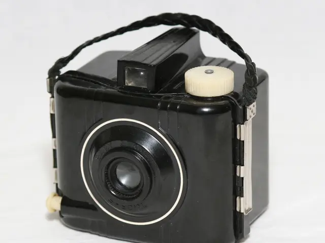 In this image we can see a camera on the surface.